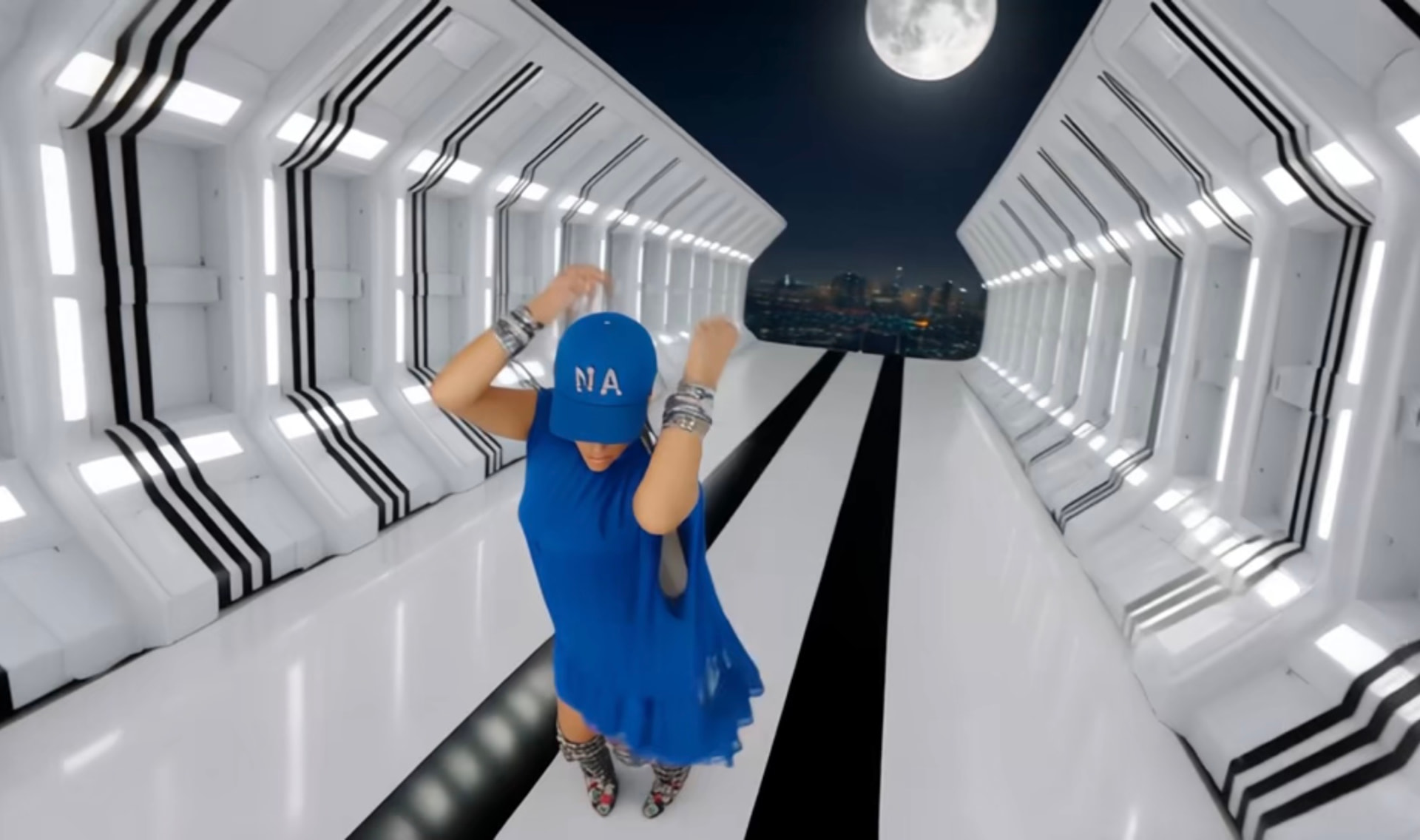 Performer dancing in a white futuristic tunnel